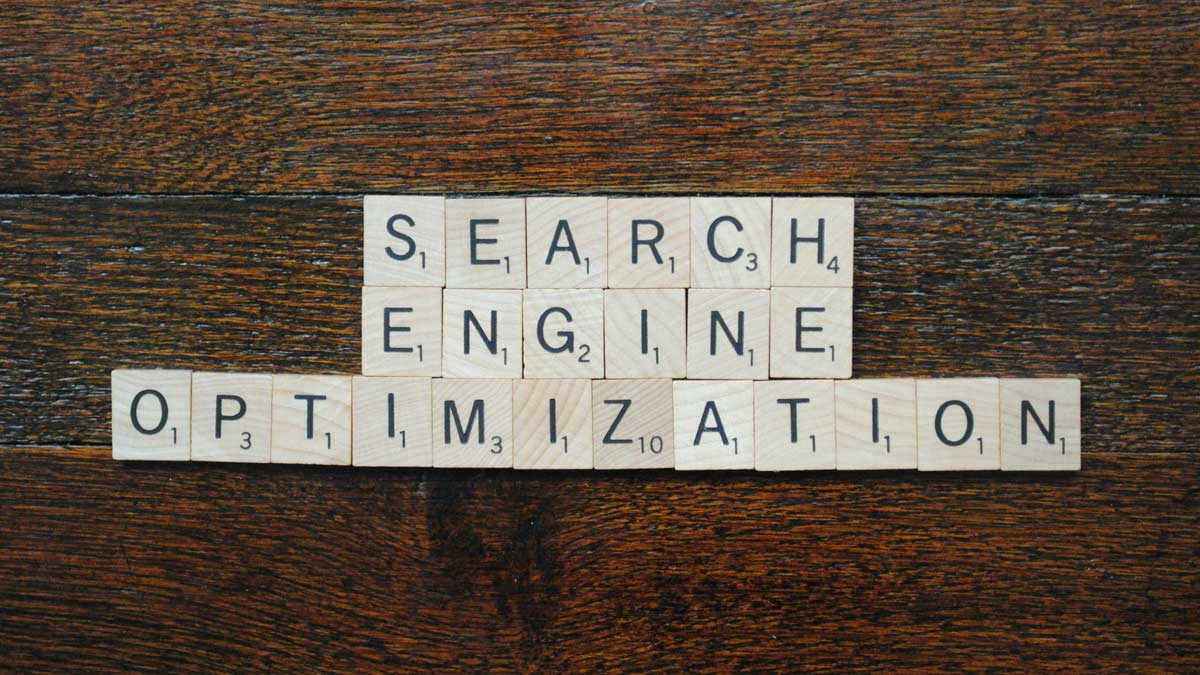 An image of scrabble pieces spelling search engine optimisation for the fullframe creative agency blog post on seo trends in 2025, Image by Sarah B on unsplash.