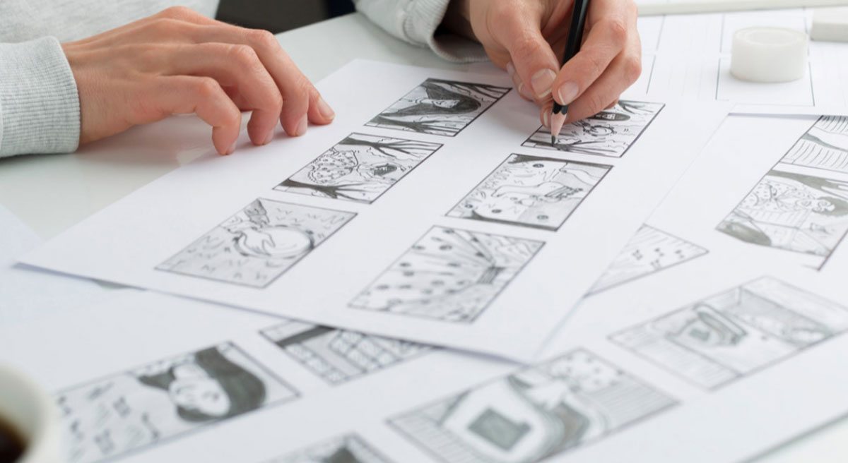 A photograph showing a female artist drawing panels for a storyboard for an animation, taken by fullframe Creative, a Swiss-based agency.