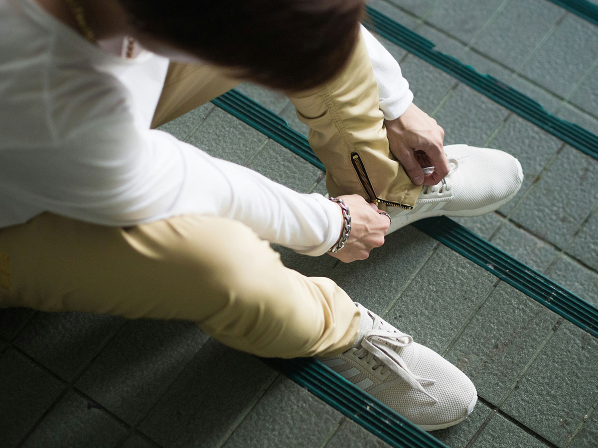 an image of a man tying his shoe for the Fullframe blogpost on interactive videos , image by black jiracheep on unsplash.