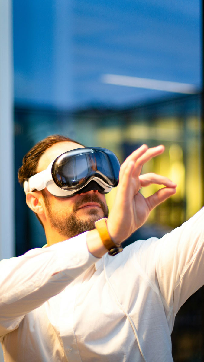 A man using a vr headset outside for the Fullframe blogpost on ar augmented reality, vr virtual reality, mr mixed reality, xr extended reality in video production. Image by bran von oost on unsplash