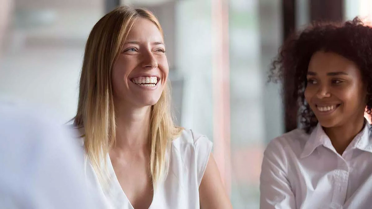Corporate photography of two women colleagues in a meeting near Lausanne, Switzerland by the Fullframe Creative Agency.