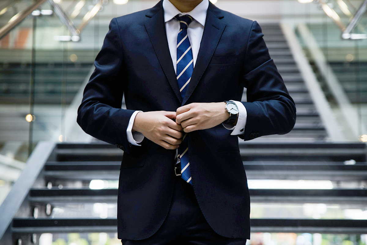 An image of a man in a suit for the fullframe blog on corporate video production, image by hunters race on unsplash