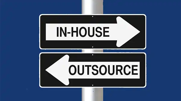 image of a sign saying in-house or outsource to show these choices when ordering video production at the fulllframe creative agency in switzerland.