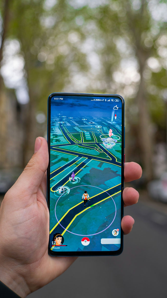 A photo of someone using augmented reality ar with pokemon go app for the Fullframe blogpost on ar augmented reality, vr virtual reality, mr mixed reality, xr extended reality in video production. Image by mika baumeister on unsplash.