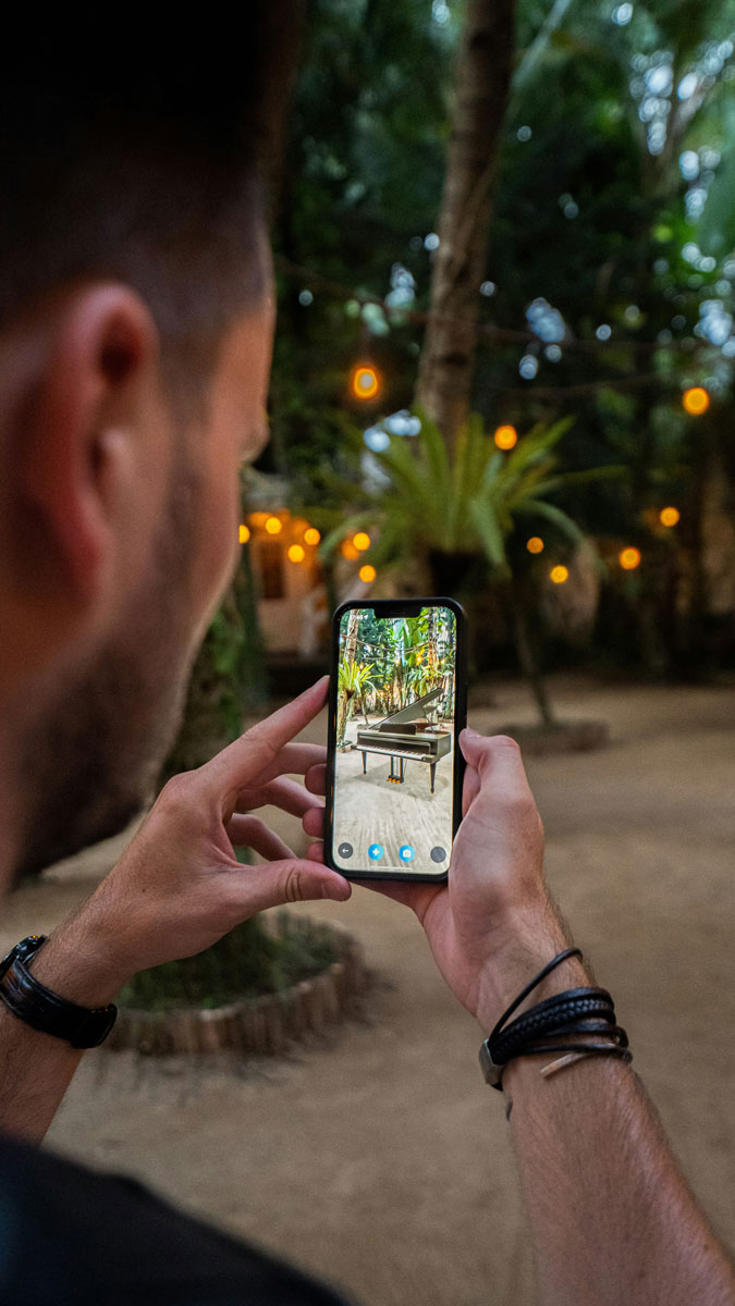 An image of someone seeing a piano with ar for the Fullframe blogpost on ar augmented reality, vr virtual reality, mr mixed reality, xr extended reality in video production. Image by remy augmento on unsplash