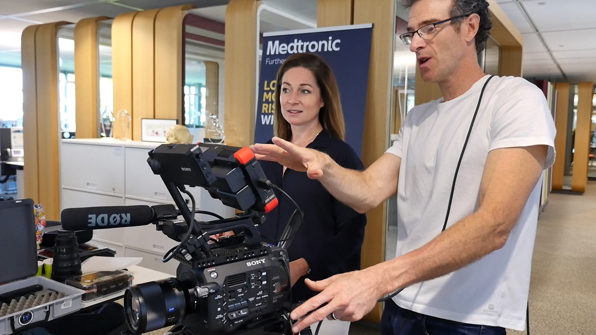 An image of a videographer discussing storytelling with a client during video production