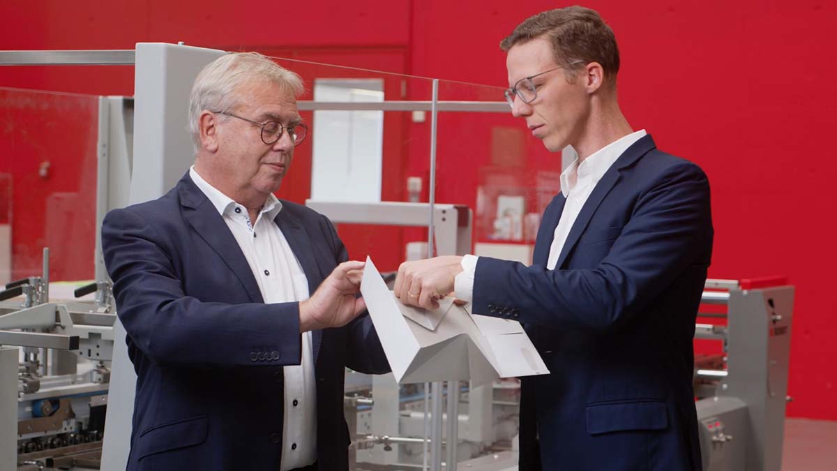 Corporate photography of two men in a packaging factory near Lausanne, Switzerland by the Fullframe Creative Agency.