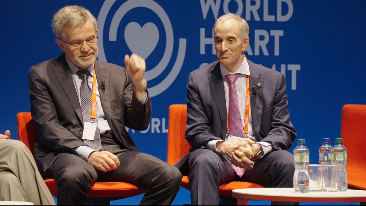 Two men on stage at an event covered by Fullframe Creative Agency's photographer.