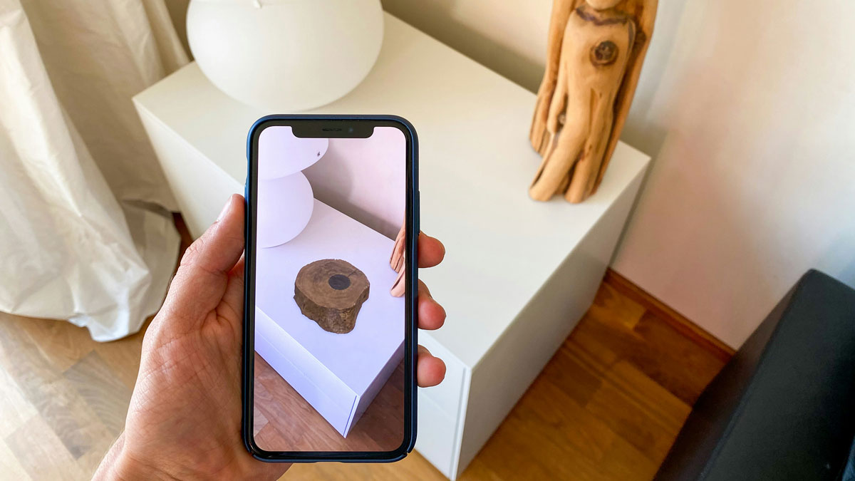 An image of an object appearing on a phone screen with augmented reality ar for the Fullframe blogpost on ar augmented reality, vr virtual reality, mr mixed reality, xr extended reality in video production. Image by uniboa on unsplash